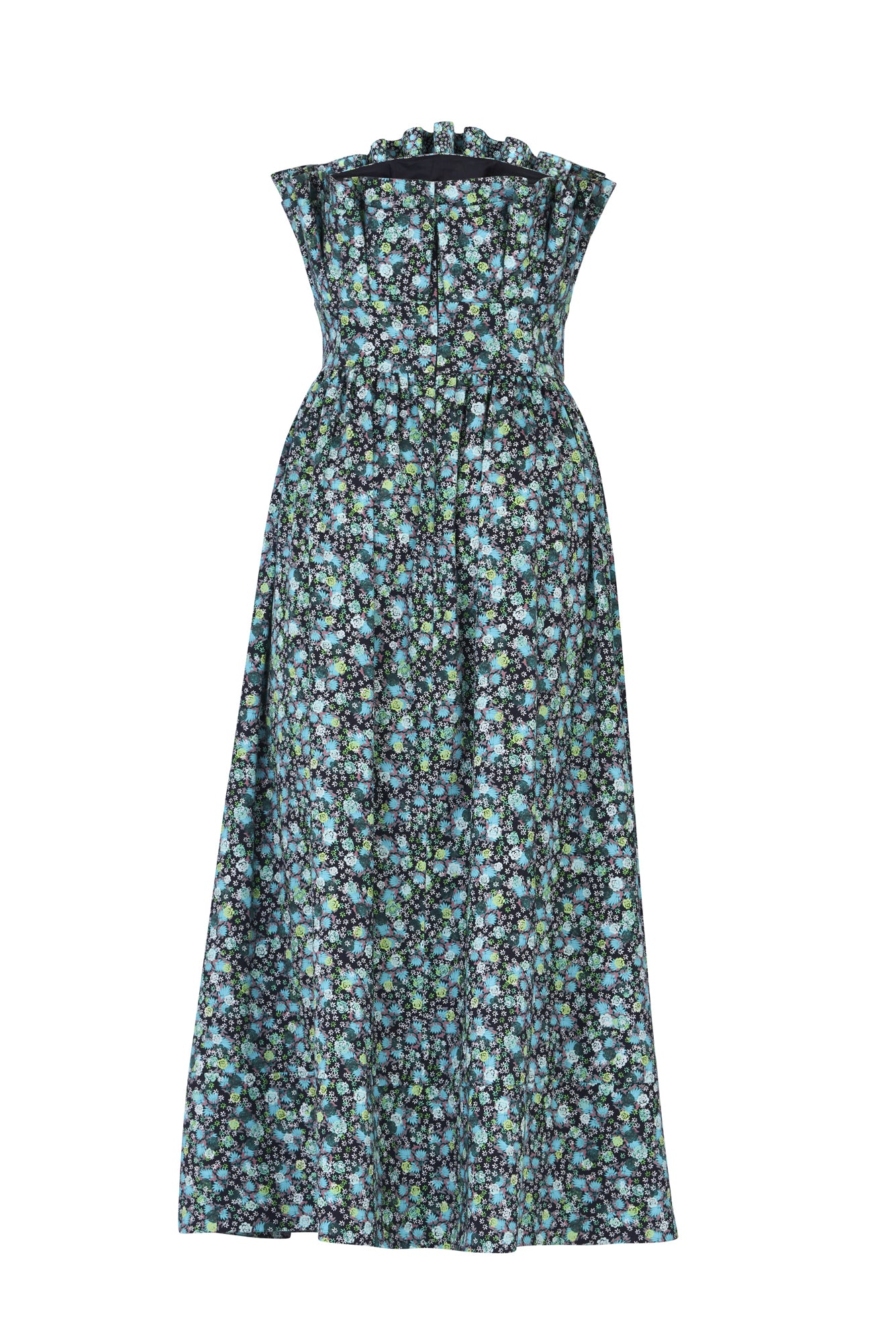 De Loreta Abanico dress in jazmin print: A midi dress with an sculptural bodice, reminiscent of delicate shells gracefully cascading over the torso. This unique design element not only adds a sense of artistry but also accentuates your silhouette, creating a flattering and eye-catching effect complemented with a blue, green and white colored floral pattern. Back view.