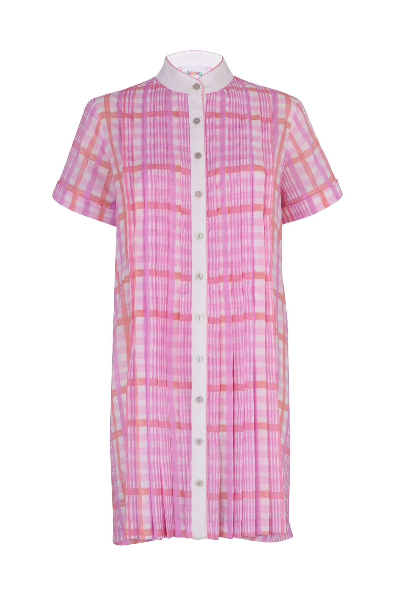 De Loreta Azulejo Dress in Loto print: Stylish mini pleated shirt dress in Loto print, featurinf a pink and lilac plaid pattern. A vibrant design with a comfortable fit. Made from high-quality cotton fabric, this versatile dress is perfect for casual and dressy occasions, offering a chic and modern look. Front view.