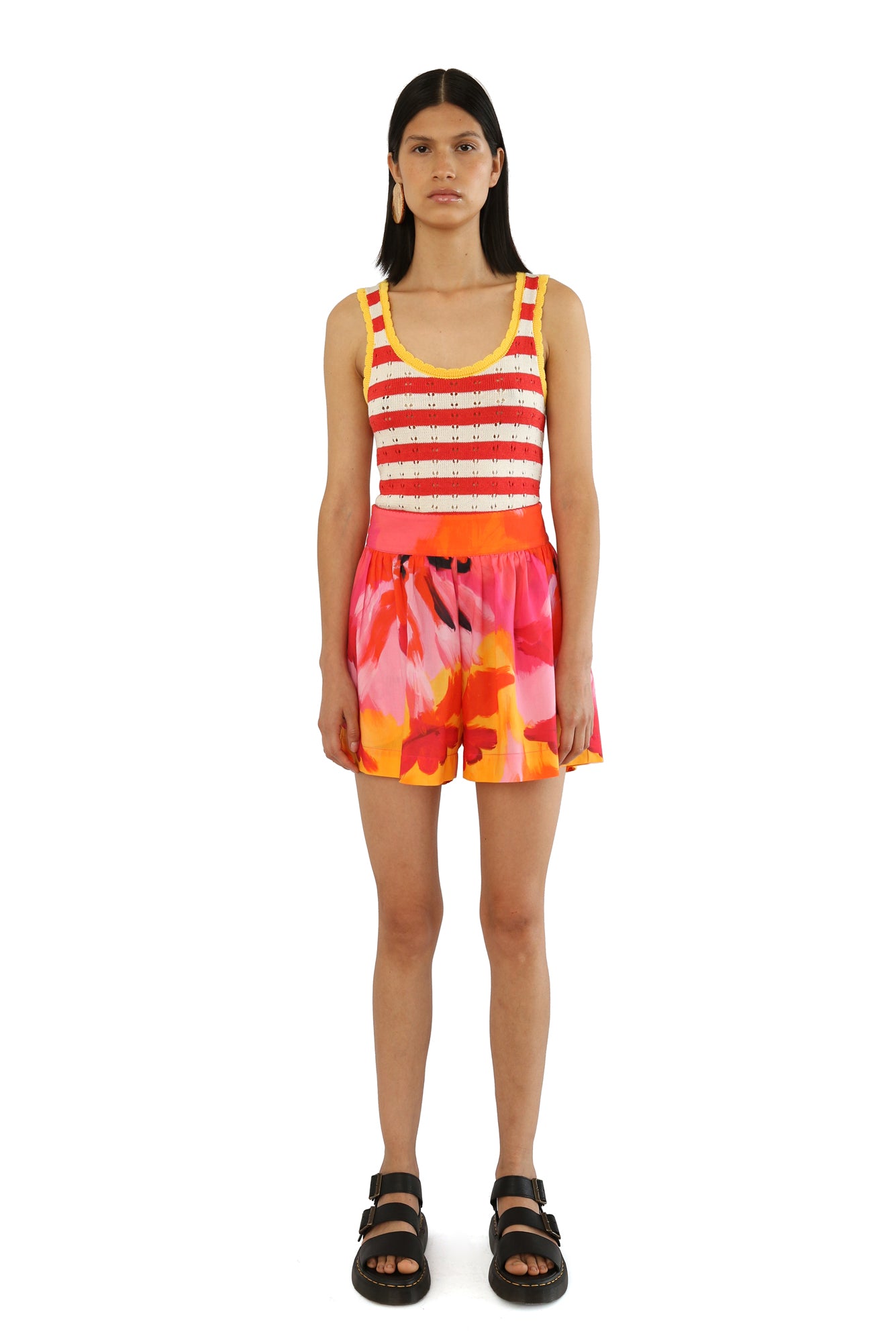 De Loreta Pachuca Shorts in Anturio Print: Vibrant Pachuca Shorts in Anturio, a red, pink and yellow colored print, featuring a stylish floral pattern and a comfortable fit. Made from high-quality fabric, these shorts are perfect for casual summer or fall wear, combining chic design with everyday comfort.