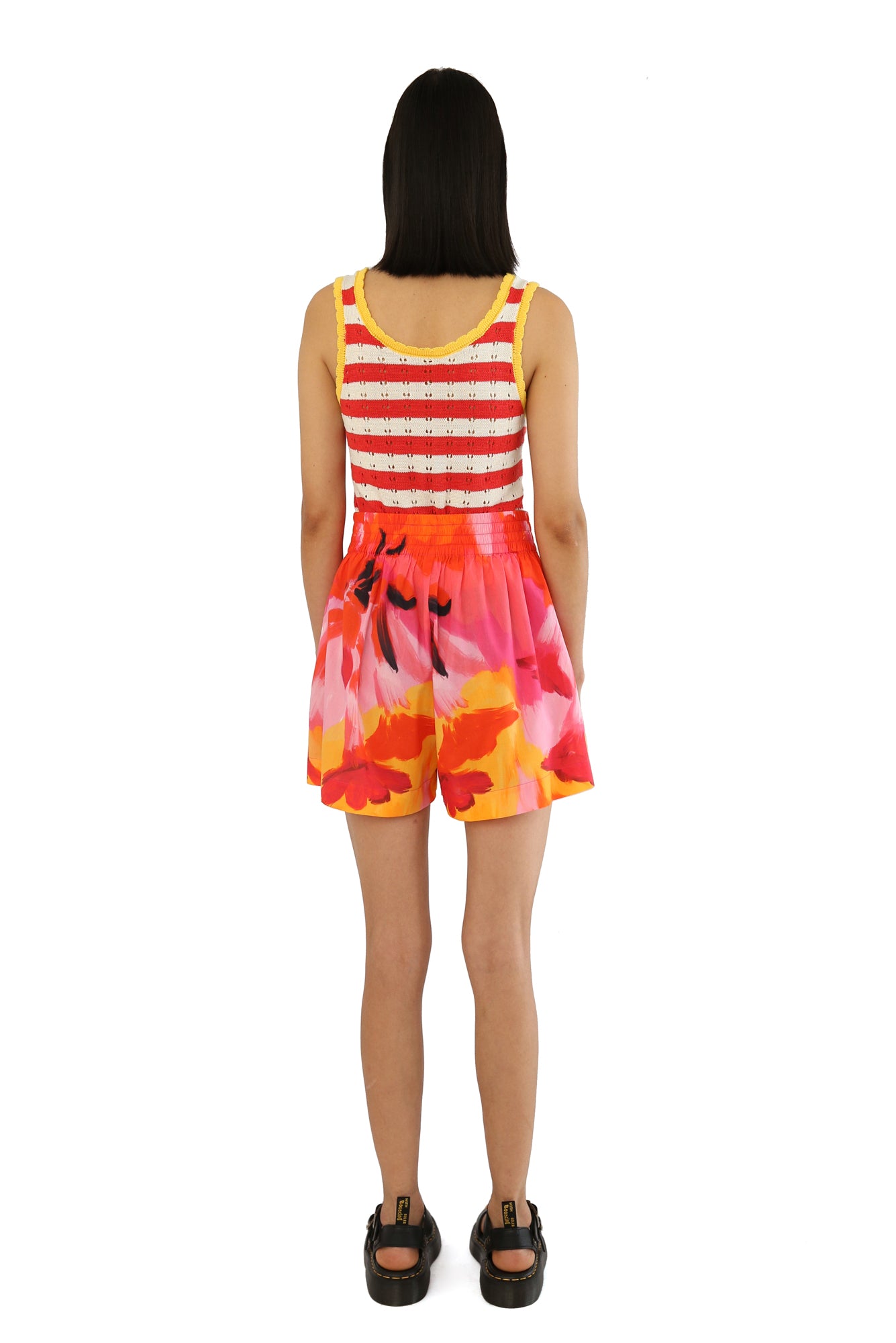 De Loreta Pachuca Shorts in Anturio Print: Vibrant Pachuca Shorts in Anturio, a red, pink and yellow colored print, featuring a stylish floral pattern and a comfortable fit. Made from high-quality fabric, these shorts are perfect for casual summer or fall wear, combining chic design with everyday comfort.