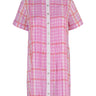 De Loreta Azulejo Dress in Loto print: Stylish mini pleated shirt dress in Loto print, featurinf a pink and lilac plaid pattern. A vibrant design with a comfortable fit. Made from high-quality cotton fabric, this versatile dress is perfect for casual and dressy occasions, offering a chic and modern look. Front view.