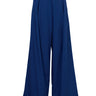 De Loreta Rocio Pants in Iris: High-waisted Rocio Pants in Iris, a nice navy and baby blue color combo, featuring a vibrant design with tailored wide-leg silhouette. These stylish pants include side pockets and a zip closure, perfect for both casual and dressy occasions. Front view.